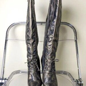 knee high pointed fashionable boots with cross over corseted straps details